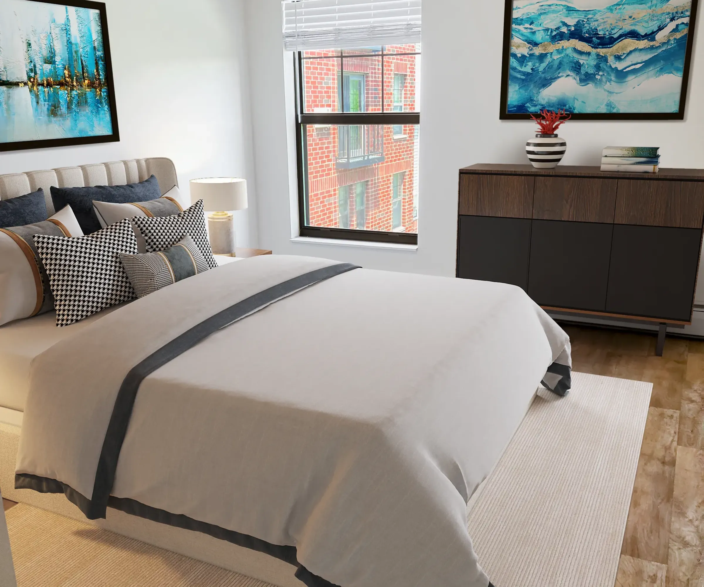 Aeon Affordable Homes and Community Modern bedroom in affordable apartment homes with a large bed, abstract art, tall window, dresser against the wall, hardwood floor, and a rug.