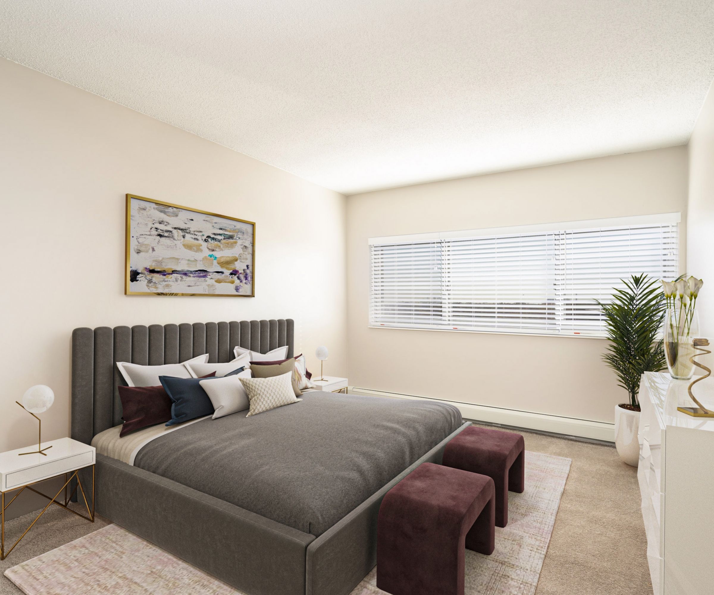 Aeon Affordable Homes and Community Modern bedroom in affordable apartment homes with a gray upholstered bed, two stools, large window, and abstract artwork on the walls.