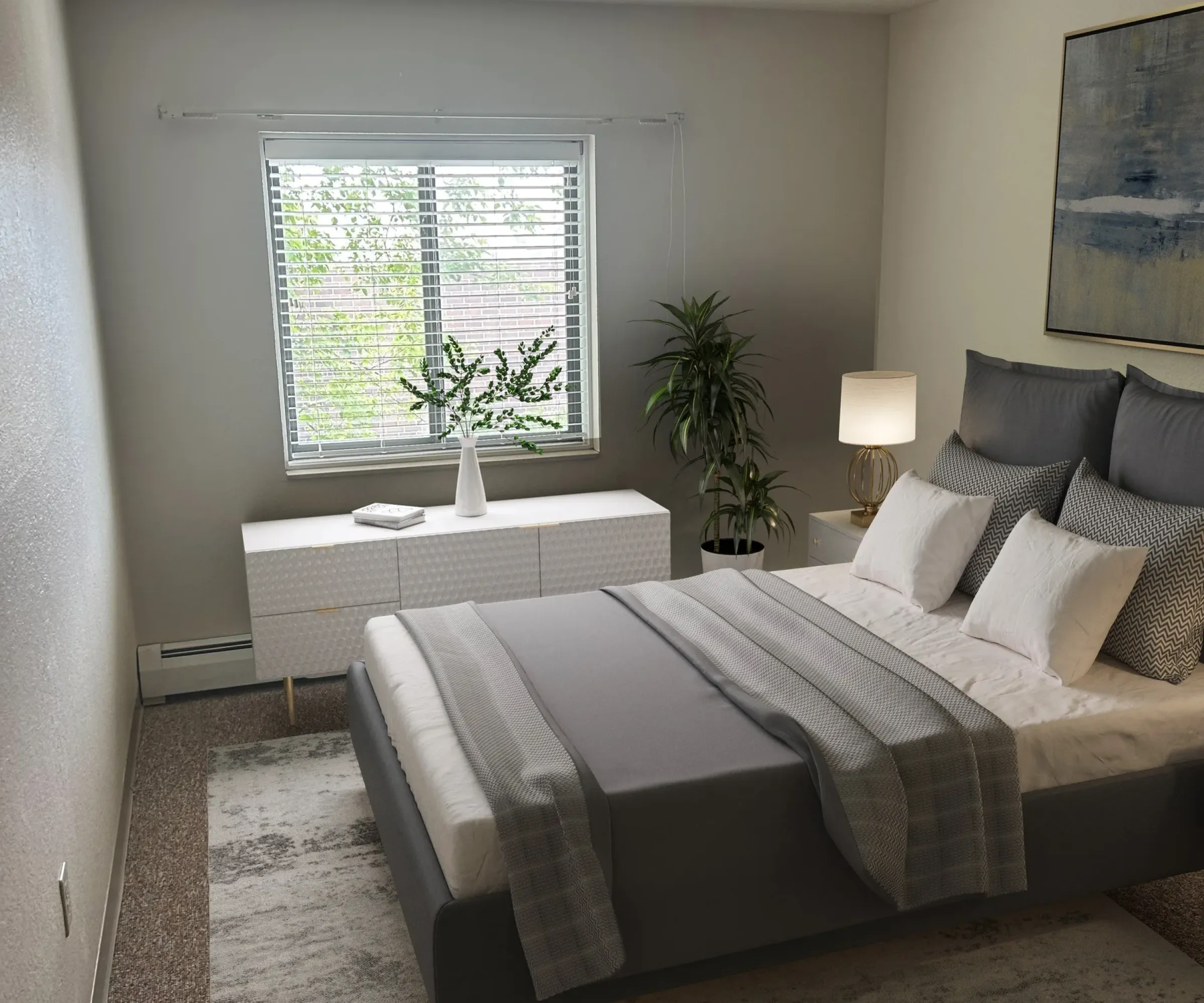 Aeon Affordable Homes and Community A modern, affordable apartment home bedroom with a gray bed, bedside lamp, plants, window, white dresser, and abstract wall art.