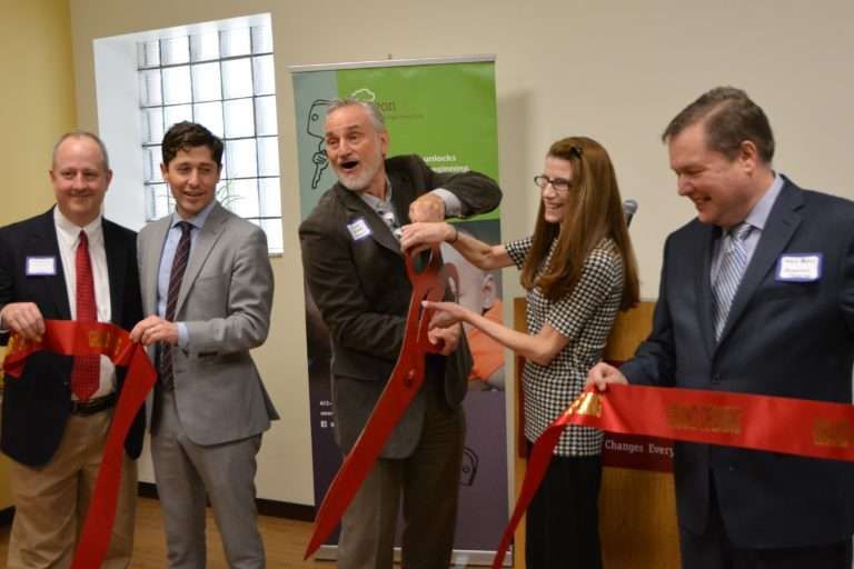 Aeon Affordable Homes Five people smiling and using large scissors to cut a red ribbon at an indoor event. Aeon Affordable Homes Five people smiling and using large scissors to cut a red ribbon at an indoor event. Aeon Affordable Homes Five people smiling and using large scissors to cut a red ribbon at an indoor event. Aeon Affordable Homes Five people smiling and using large scissors to cut a red ribbon at an indoor event.