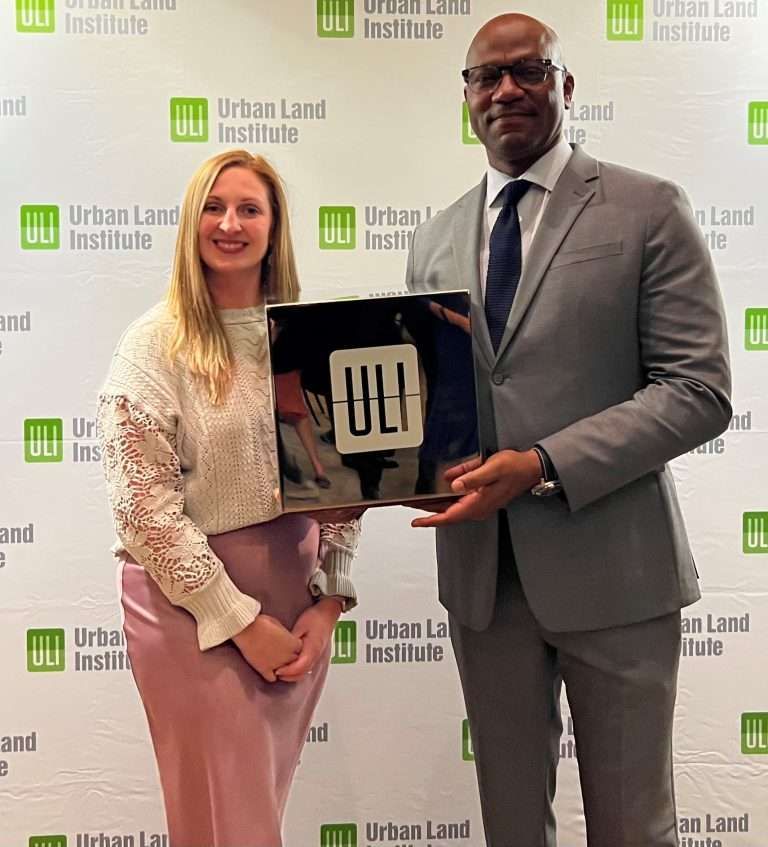 Aeon Affordable Homes Two people posing with an award in front of a backdrop that reads "Urban Land Institute. Aeon Affordable Homes Two people posing with an award in front of a backdrop that reads "Urban Land Institute. Aeon Affordable Homes Two people posing with an award in front of a backdrop that reads "Urban Land Institute. Aeon Affordable Homes Two people posing with an award in front of a backdrop that reads "Urban Land Institute.