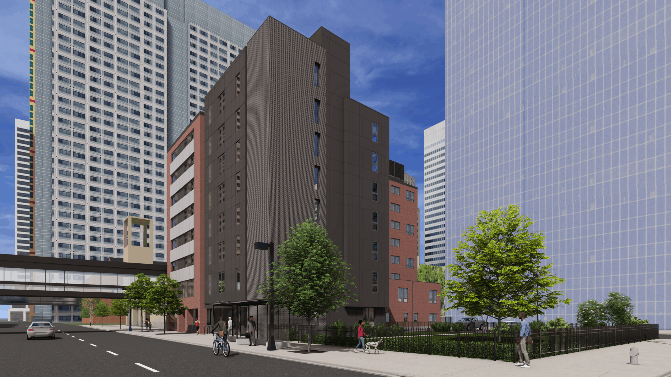 Aeon Affordable Homes A mid-rise brick apartment building in downtown Minneapolis, surrounded by tall glass skyscrapers and trees, offers affordable housing.